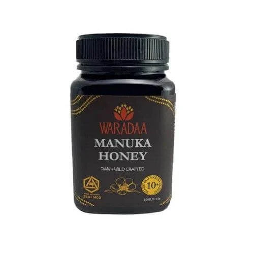 Jar of Waradaa Australian Manuka Honey with 250 MGO, 250g, showing the honey's golden color and label on the jar.