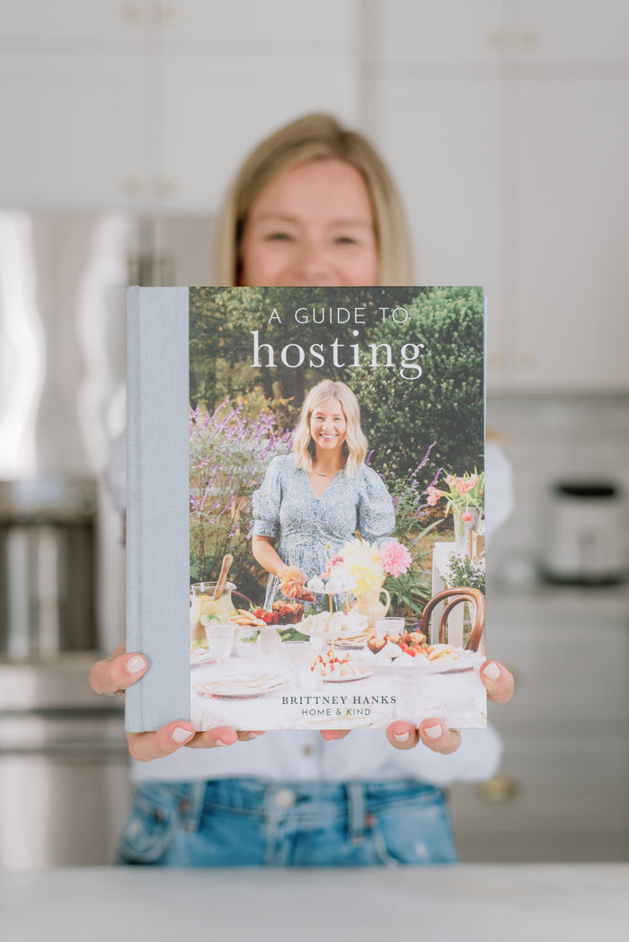 A Guide to Hosting Cookbook styled with a hosted table