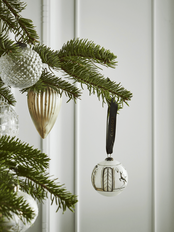 Deck the halls and dress the tree with the art deco style of Claridge’s.  Using a time-honoured ‘inside out’ painting technique, this hand-blown glass bauble depicts the leaping deer motif that features in Claridge's lobby.  The deer is a popular form in Art Deco design and our leaping deer was originally inspired by art deco lamps designed by Dreyfous.