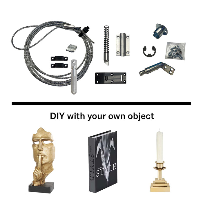 Murphy Door® DIY hardware kit with cable, fasteners and mounting components, shown with decorative objects including gold statue, style book and candle holder.